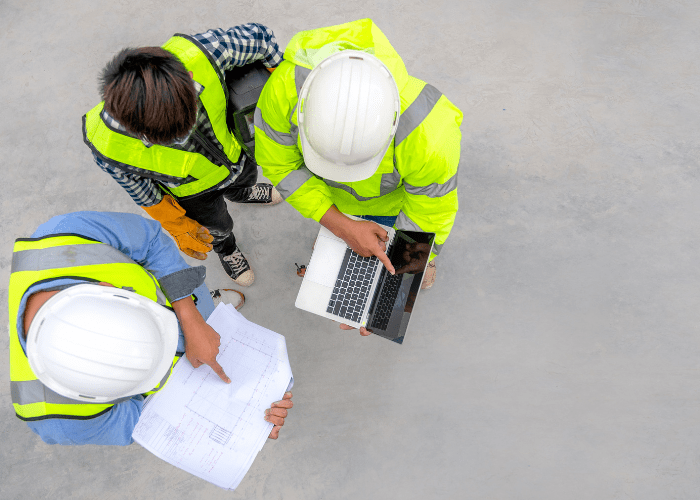 A group of inspectors looking at building plans before they undertake a compartmentation survey.  